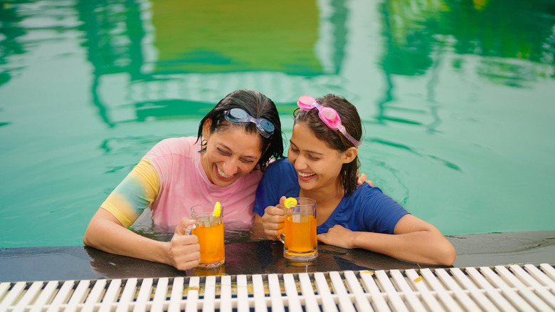 Parkgoers enjoying a drink in a pool