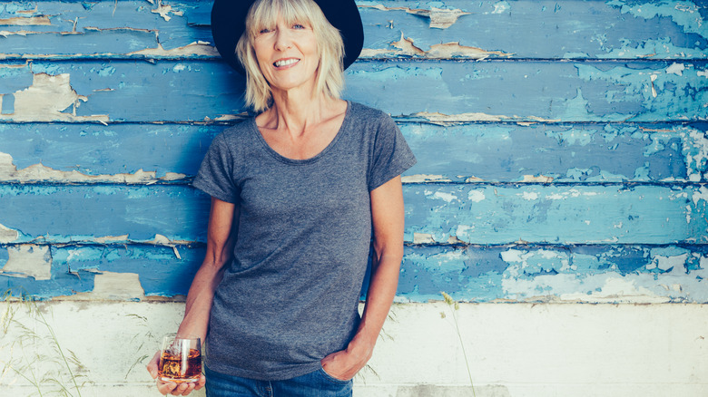 Woman drinking bourbon