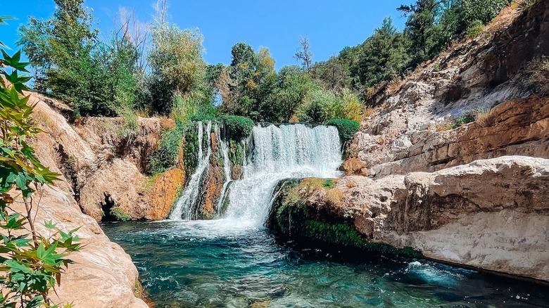 waterfall and turquoise pool