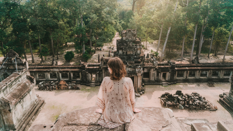 Traveler sitting at Angkor Wat