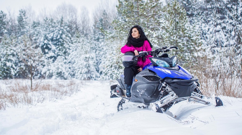 Woman snowmobiling