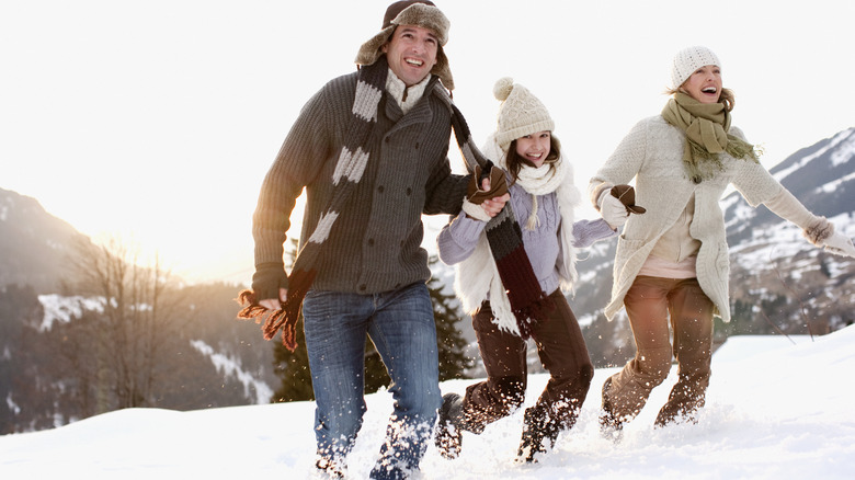 Friends running in the snow