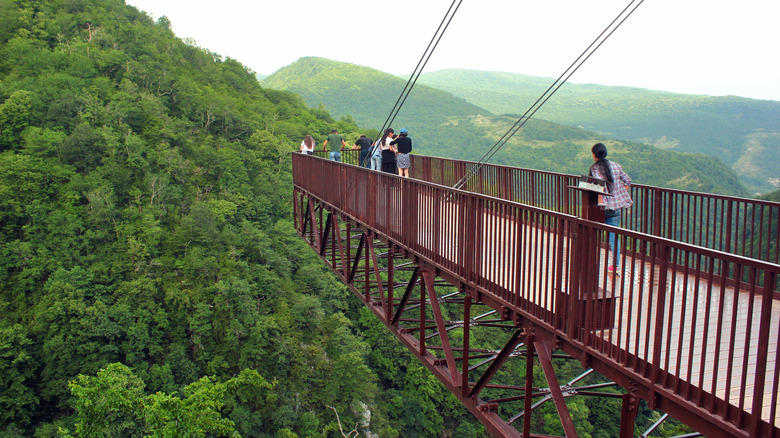 Tourists on the hanging trail in Okatse Canyon