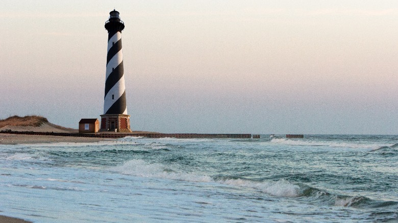 stripey lighthouse by the sea 