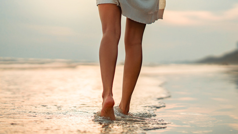Person walking along the beach