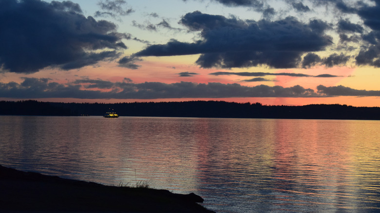 A ferry crosses Puget Sound at sunset