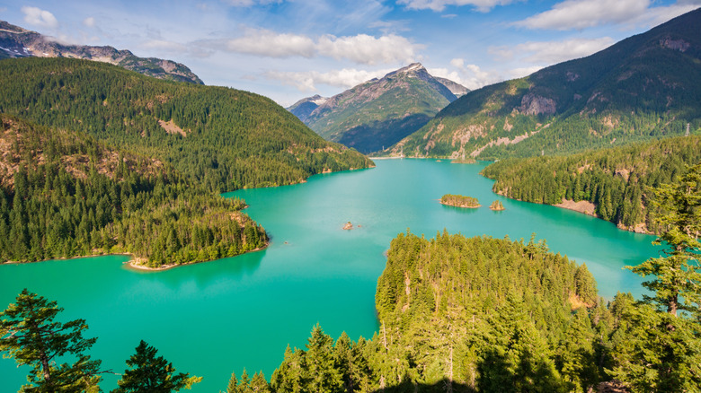 an opaque turquoise lake in the mountains