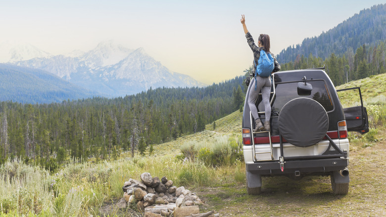 a solo camper overlooking mountains