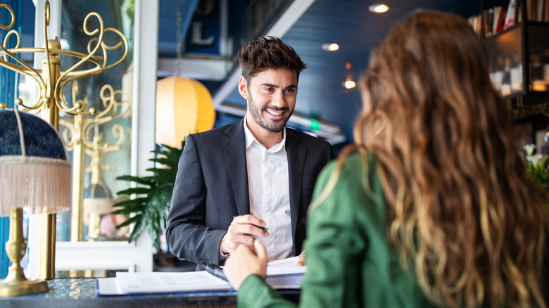 male concierge talking to guest