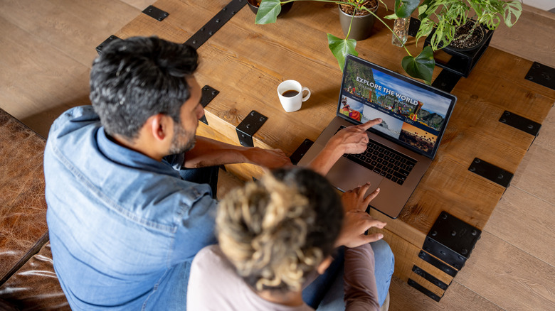 couple on computer travel planning
