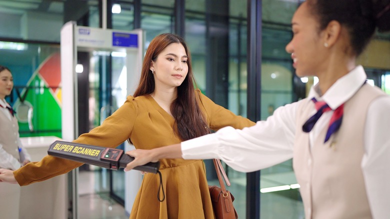 Woman being screened by TSA