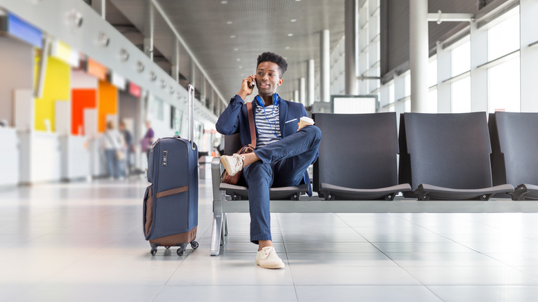 Man on phone at airport