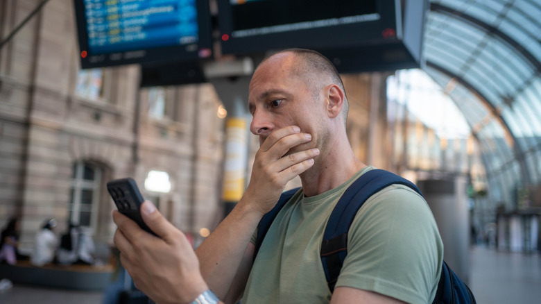 Stressed out man at train station