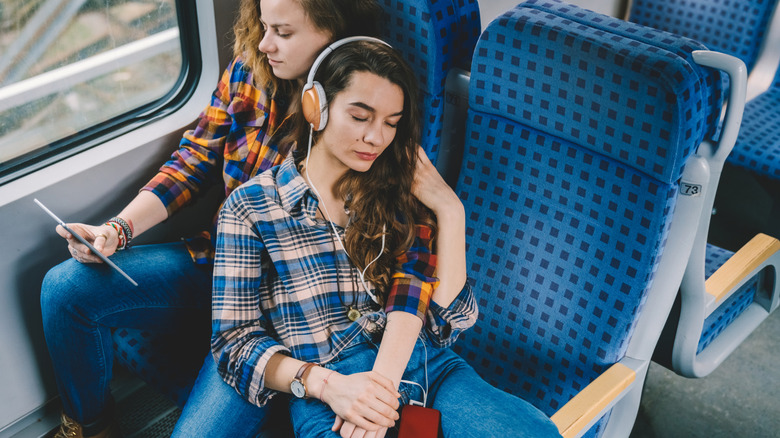 Couple napping on train