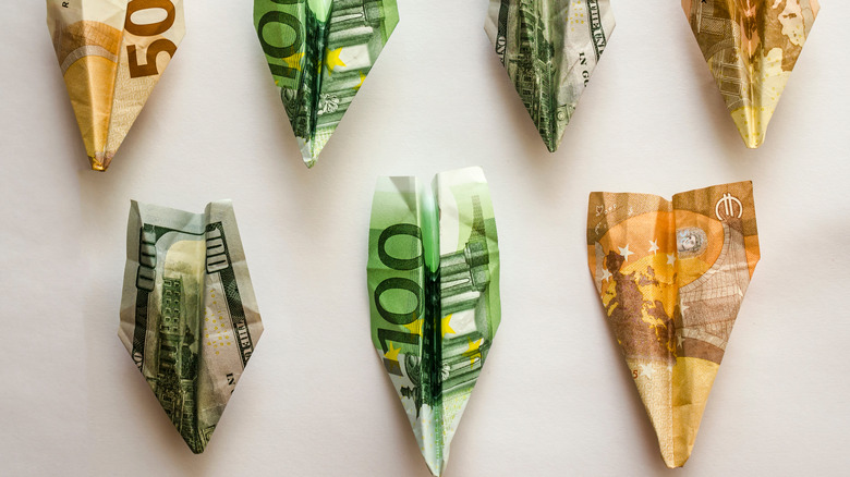 paper planes made from international currency