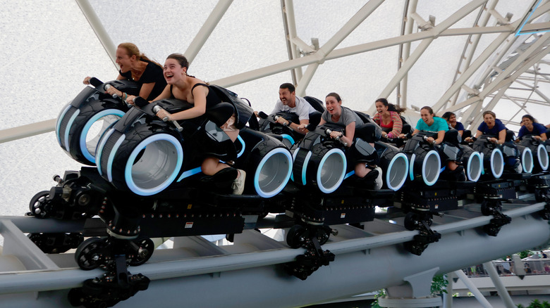 Guests riding TRON Lightcyle Run at Magic Kingdom