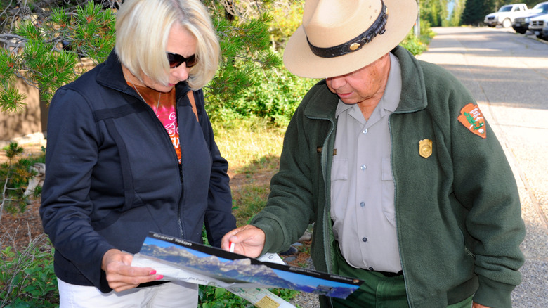 Park ranger helping a visitor