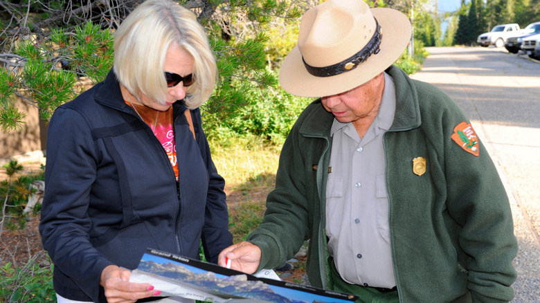 Park ranger shows woman map