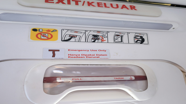 Exit sign near airplane window