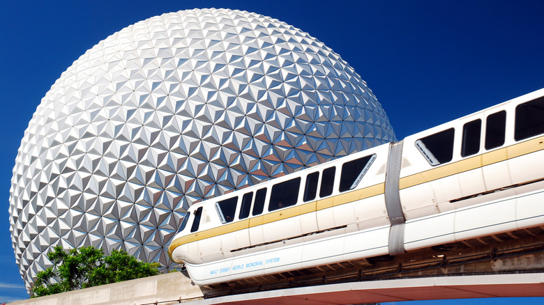 Epcot monorail Spaceship Earth blue sky