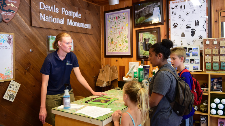 Family talking to park employee
