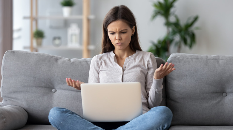 Confused woman with laptop