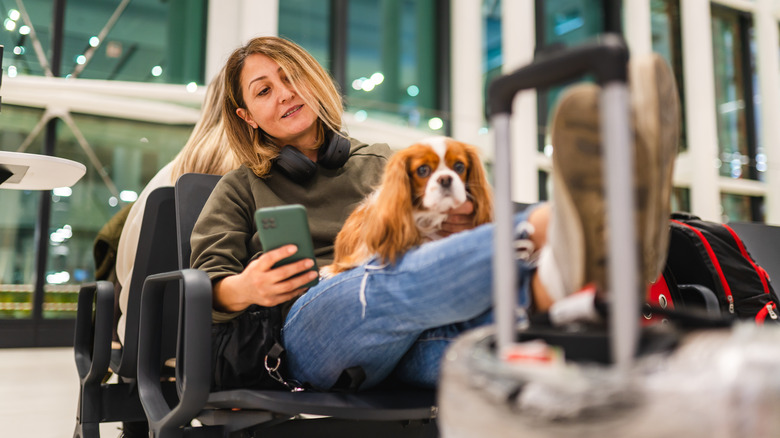 woman at airport with dog