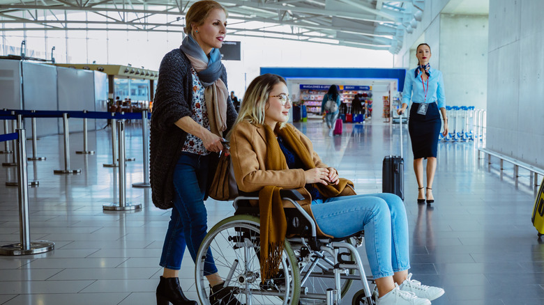 person in a wheelchair at airport