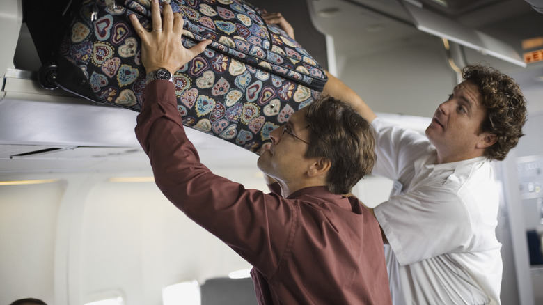 Luggage overhead bins on plane