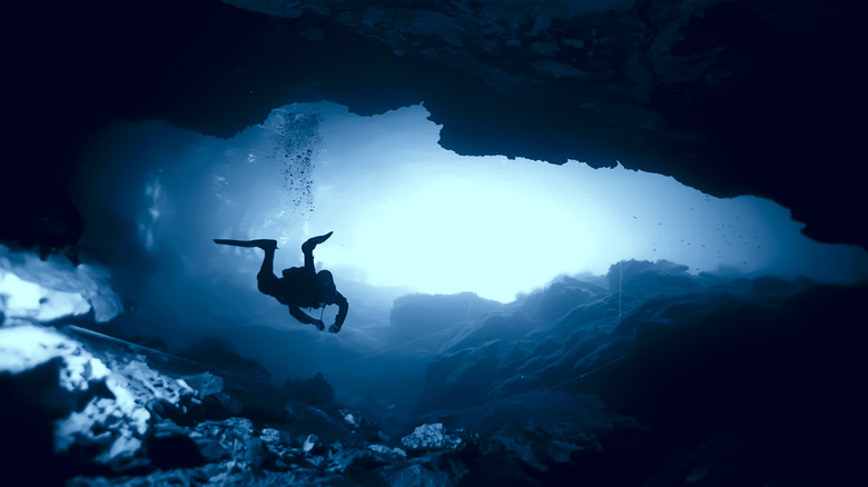 diver in underwater cave