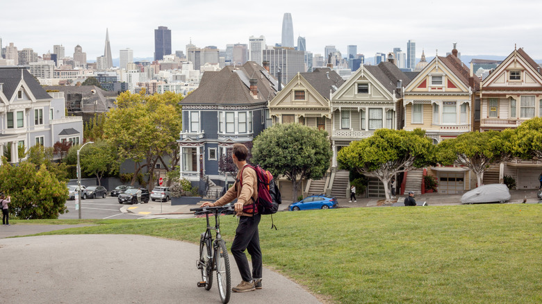 A cyclist looking at the San Francisco skyline.