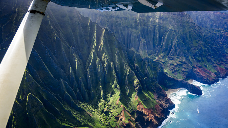 A view from an airplane reveals seaside cliffs in Hawaii