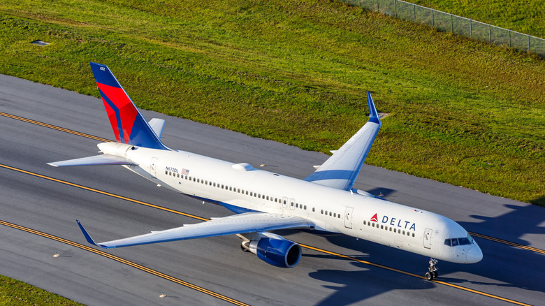 A Delta plane on a runway.