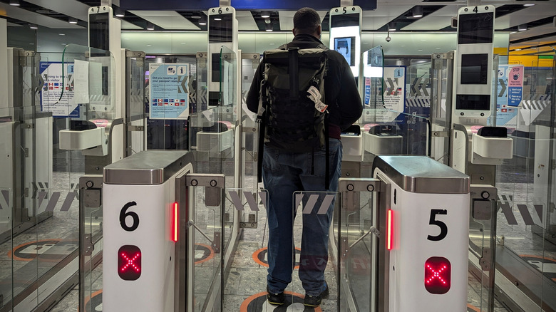 A man passing through an automated border control.