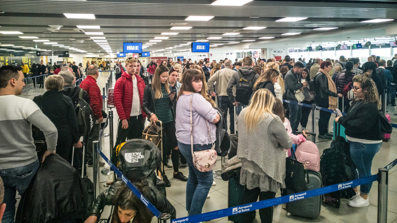 Long airport queues at Rome Fiumicino Airport.