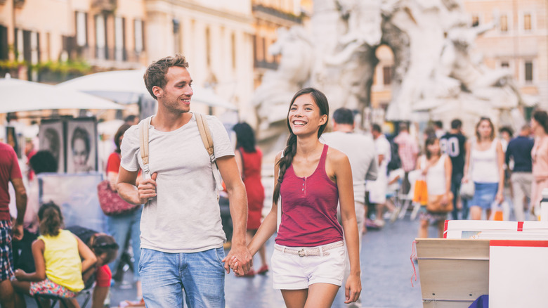 Couple walking through Rome