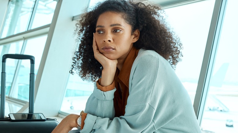 Sad woman at airport