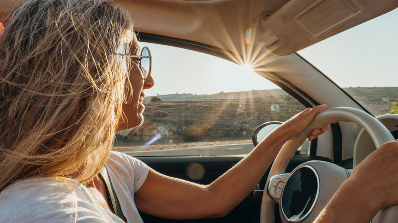 woman driving in desert