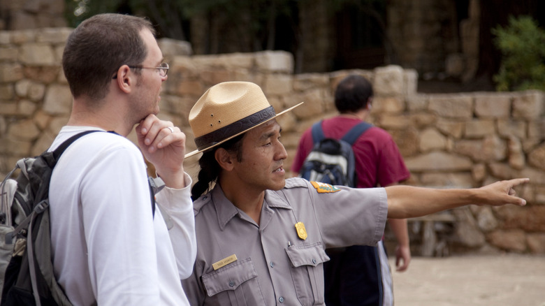 Grand Canyon park ranger helps tourist