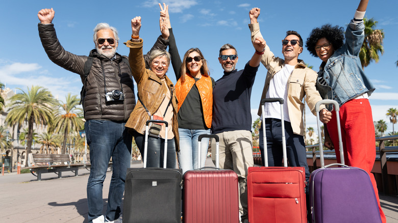 group of diverse travelers smiling