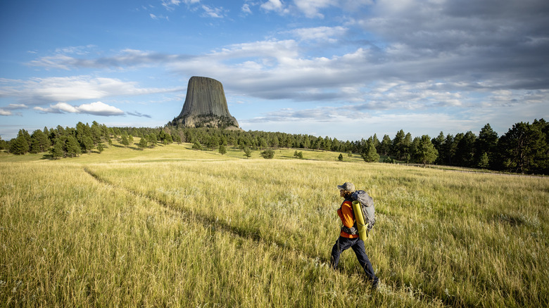 person hiking to Devils Tower