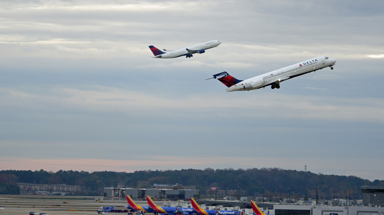Two planes taking off at ATL.
