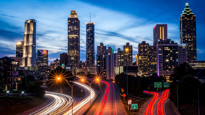 Atlanta skyline at night with roads leading into the city