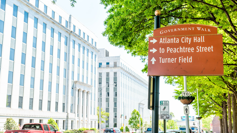 Atlanta buildings with direction sign in foreground