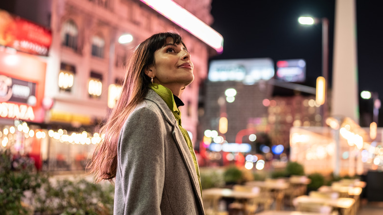 Young woman waiting in city