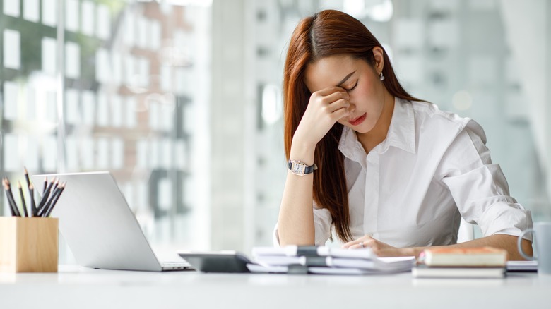 Stressed woman at desk