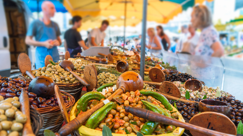 baskets of olives on a market stall in Provence