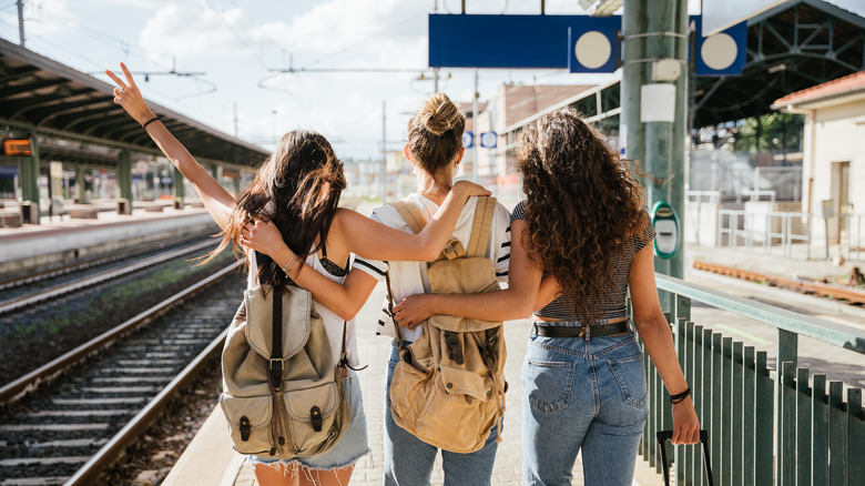 three women on train platform