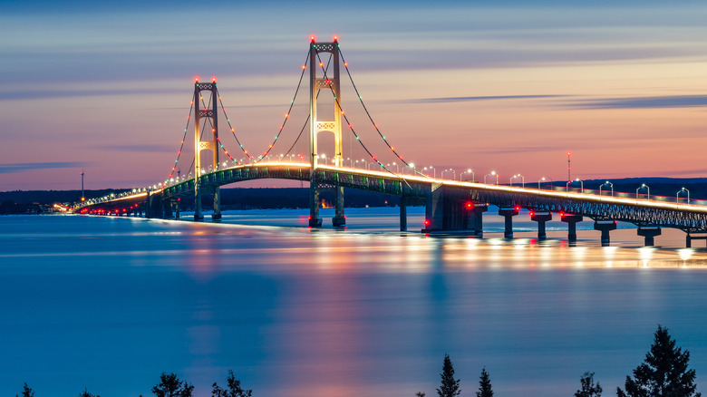 Mackinac Bridge lit up at sunset