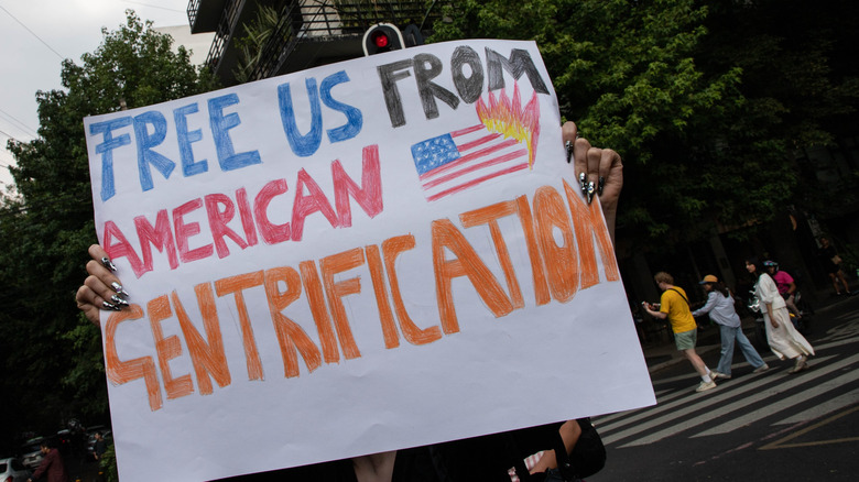 a protest sign in Mexico City "Free us from American gentrification"